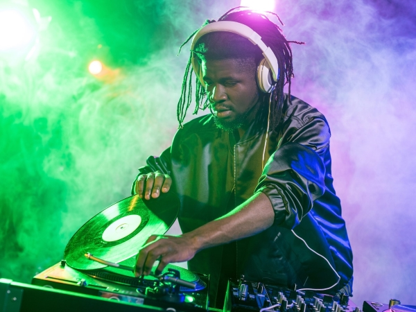 A DJ is using Headphones 
