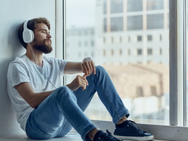 A man is enjoying music with headphones